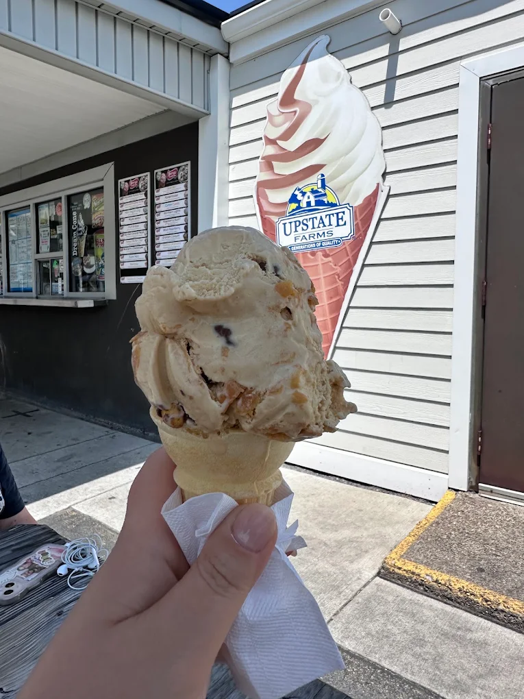 Hand-scooped cone in front of the Upstate Farms cone sign