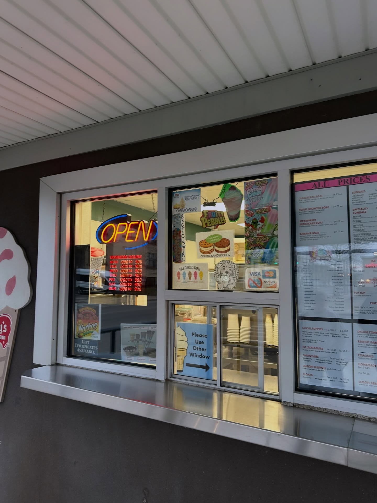 Storefront window with neon open sign